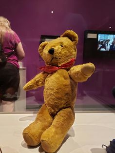 a large teddy bear sitting on top of a table