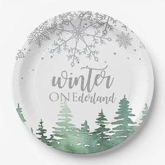 a paper plate with the words winter on it and snowflakes in the background