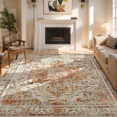 a living room filled with furniture and a large rug on top of a hard wood floor