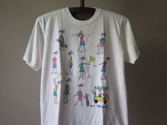 Vintage Golf T Shirt Golf Cartoon Juli Orignal Designs 1989 Golf Painting Tee Pop Art Vintage Art T Shirt Artist Tee Shipping from the US. Easy 30 day return policy, 100% cotton, Double-needle neck, sleeves and hem; Roomy Unisex Fit. Golf Cartoon, Golf Painting, Pop Art Vintage, Artist Tees, Vintage Golf, Golf T Shirts, Art T Shirt, Stylish Shirts, Art Vintage