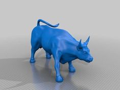 a blue bull standing on top of a white floor