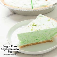 a slice of key lime jello pie on a plate with the rest of the pie in the background