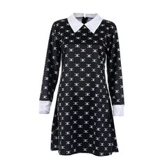 a black and white dress with stars on the collar, long sleeves, and cuffs