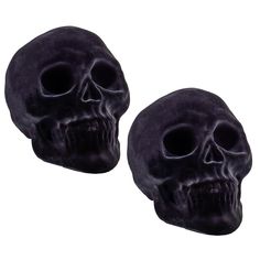 two black skulls are shown against a white background