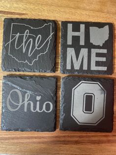 four slate coasters with the words home and ohio on them