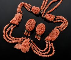 "Stunning Chinese export salmon coral sterling necklace and earrings set C 1920. 5 salmon coral plaques are prong set in custom made sterling frames. The plaques are meticulously hand carved with centuries old traditional Chinese fruit and leaves motif. They are connected with 3 swags of strung coral beads. The back of the necklace has 2 swags. The necklace is 17\" around neck. Front plaque measures 1\" X 7/8\" The 2 middle plaques are approx. 1 1/8\" long, the 2 top ones are approx. 3/4\" long. Phoenix Jewelry, Miriam Haskell Jewelry, Abstract Jewelry, Vintage Jewelry Sets, Art Earrings, Sterling Necklaces, Coral Jewelry, Coral Necklace, Antique Art Deco