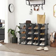 a shoe rack in the corner of a room with shoes and bags hanging on it