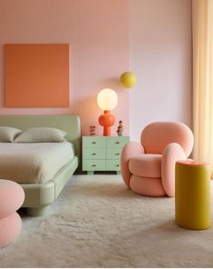 a bedroom with pink walls and furniture in the corner, along with a white rug on the floor