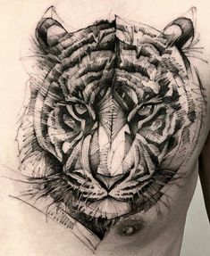 a man's chest with a tiger tattoo on his chest and the image of a tiger