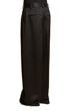 Pronounced pleats structure baggy pants fashioned from luminous satin in a wide-leg silhouette. 33" inseam; 23" leg opening; 11 1/2" front rise; 15" back rise (size 2) Zip fly with hook-and-bar closure Front slant pockets; back welt pockets 100% viscose Dry clean Made in the USA Designer Clothing Luxury Gray Bottoms With Belt Loops, Satin Wide Leg Pants, Baggy Pants, Baggy Pant, Fabric Gift Bags, Nordstrom Store, Fabric Gifts, Free Fabric, Black Fits