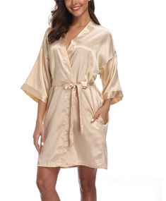 PRICES MAY VARY. Silky Polyester（Satin) Self Tie closure Machine Wash Solid color satin robes for women with elegant oblique V-neck clear design. Made from quality satin fabric, lightweight, soft, comfy; Dear, you will feel like wearing an expensive silk robe. With 2 side pockets, belt loops and inside ties.Elegant yet sexy V neck short robes for women. Available in multiple colors and sizes, perfect for weddings, gifts, or everyday wear. Machine wash cold; Gentle cycle; Tumble dry low; Dry clea Champagne Bridal Robes, Satin Robe Bridesmaid, Gold Bridesmaids Robes, Taupe Bridesmaid Robes, Champagne Quince Robe, Bridal Party Dressing Gowns, Monogram Robes, Short Kimono Robe, Summer Loungewear