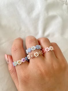 🌸  Cute and colorful 8 petal bead rings 🌼  The rings are made of nylon string so it is not super stretchy. Please message me if you have size specifications!  🌈  All things are handmade carefully, but excess glue and string might be visible up close. To preserve this ring and all its beautiful colors, avoid wetting it as much as possible :) Daisy Rings, Beaded Daisy, Rings Flower, Rings Dainty, Bead Rings, Pretty Jewelry Necklaces, Bead Charms Diy, Beads Bracelet Design, Handmade Jewelry Tutorials