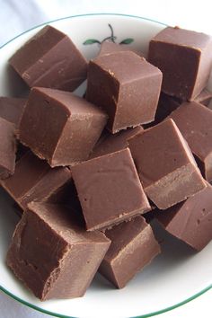 a pile of chocolate pieces sitting on top of a white plate