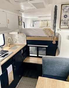 the interior of a camper that has been converted into a kitchen and living area