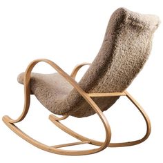 a rocking chair made out of wool and wood