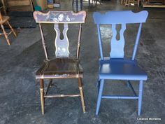 two wooden chairs sitting next to each other in a room filled with tables and chairs