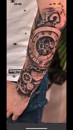 a man's arm with a clock and gears tattoo on the left side of his arm