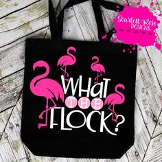 a black bag with pink flamingos on it that says what to the flock?