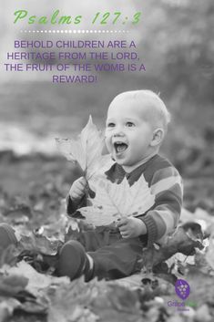 a baby sitting on the ground with leaves in front of him and bible verse below