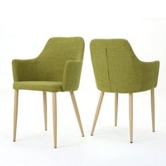 two green chairs sitting next to each other on top of a white floor with wooden legs