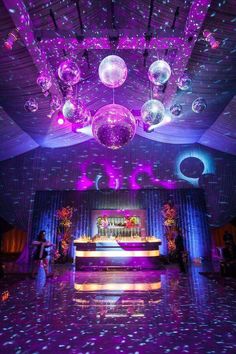 a disco ball dance floor with purple lights