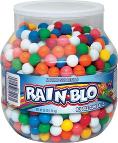 a large jar filled with lots of colorful gummy balls on top of a white background