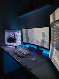 two computer monitors sitting on top of a desk