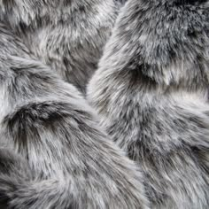 grey and white fur is shown in close up