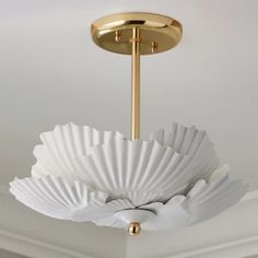 a white ceiling light hanging from the ceiling