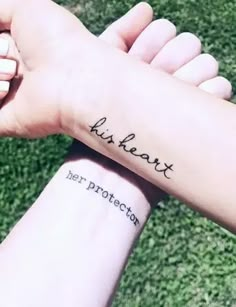 two hands holding each other with writing on their wrist and the words, just heart her protection