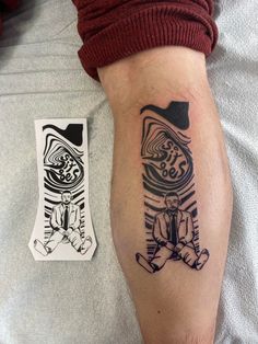 a man with a tattoo on his arm next to a piece of sticker art