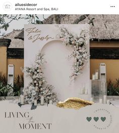 the wedding sign is decorated with flowers and candles in front of a backdrop that says,