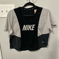 Nwt Color Block Short Sleeve Cropped Dri-Fit Nike Tshirt New With Tags, Never Worn Gray Crew Neck Athleisure Tops, Gray Graphic Print Athleisure Tops, Nike Gray Tops With Letter Print, Nike Gray Sports Top, Gray Nike Sports Top, Nike Black Crew Neck Top, Nike Gray Sporty Top, Gray Sports Top With Graphic Print, Gray Graphic Print Sports Top