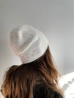 White beanie hat with sequins  is a hand knitted hat which I made of natural rabbit hair. It is embellished with holographic sequins. The hat is in stock and can be shipped right away.  COLOR: white It is very beautiful and matches different jackets and coats. I use high quality yarn so it will not irritate your skin.  This angora hat is fluffy and suits to any face shape.  SIZE: The hat is suitable for head size 53-60cm or 21*22.9* CARE INSTRUCTIONS: Hand wash at 30oC/ 86oF. Care instructions a Holographic Sequins, White Beanie, White Beanies, Handmade Knitwear, Hand Knit Hat, Slouchy Hat, Winter Beanie, Simply Lovely, Beautiful Hats