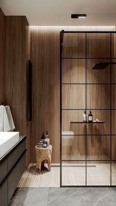 a modern bathroom with wooden walls and flooring