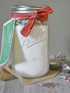 a mason jar filled with sugar and sprinkles