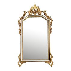 an ornate gold framed mirror against a white background