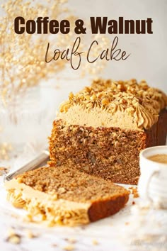 coffee and walnut loaf cake on a white plate with a slice cut out from it