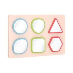 a pink and blue magnet board with four shapes on the front, one is shaped like hexagons