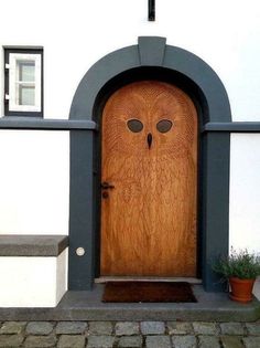 an owl door is shown in front of a house