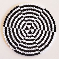 a black and white circular design made out of legos