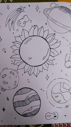 the sun and planets are drawn on paper