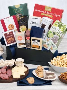 an assortment of snacks and crackers on a table