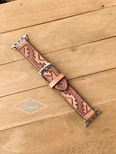 a brown watch band with an intricate design