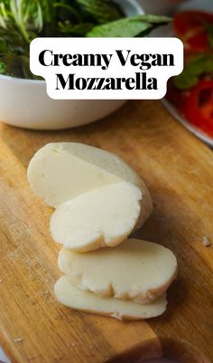 the ingredients for creamy vegan mozzarella on a wooden cutting board with text overlay