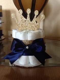 a diaper cake with a crown on top