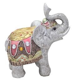 an elephant figurine with a crown on it's head and tusks