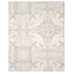 a white rug with an intricate design on it