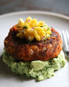 a white plate topped with food and a fork