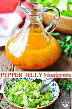 a salad in a bowl next to a bottle of pepper jelly vinaigrete